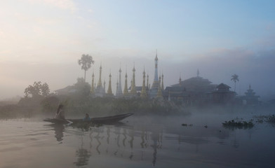Pa-O tribe people floating in wooden boat on Inle lake, Myanmar