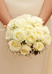 Bride with bouquet of flowers. Close up