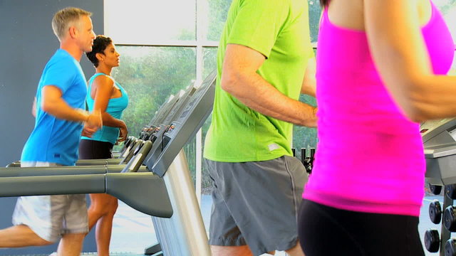 People Exercising Health Club Equipment