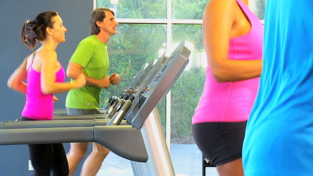 People Exercising Health Club Equipment
