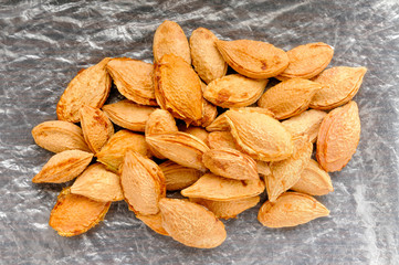 Plum kernels on a cellophane background