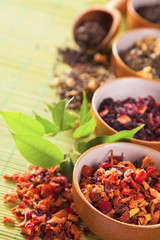Various dry tea in small bowls