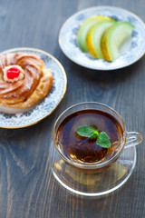 Breakfsat with melon, tea and cake