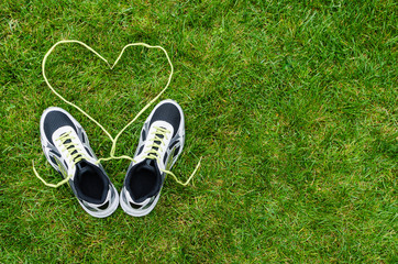 Sneakers on grass with heart