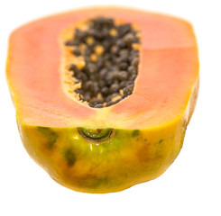 Papaya fruit over white background