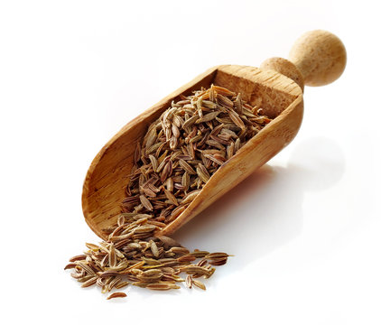 wooden scoop with cumin