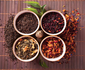 Various dry tea in small bowls