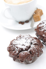 chocolate cake and a cup of cappuccino with brown sugar, closeup