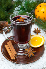 Christmas mulled wine with spices in glass, vertical