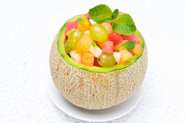 fruit salad in melon, horizontal
