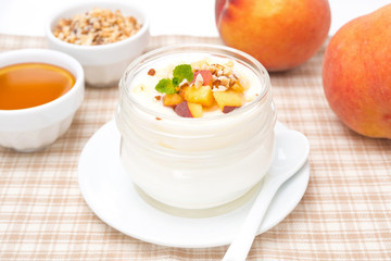 homemade yogurt with honey, fresh peaches and nuts