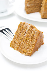 piece of honey cake on a white plate
