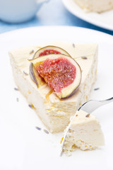 piece of cheesecake with honey and lavender and fresh figs