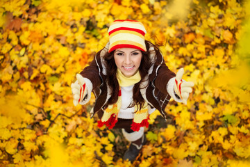 Happy smiling girl in autumn park