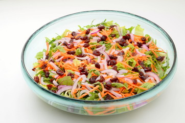 Mixed salad of cranberry and carrot with lettuce and baby leaves