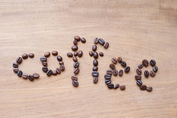 Word COFFEE made from roasted coffee beans