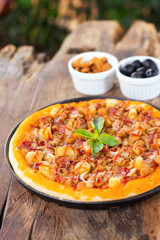 Fresh pizza on a wooden board