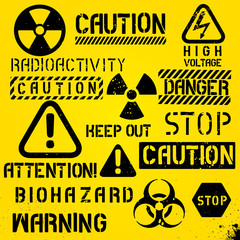 Set of warning hazard symbols and text