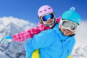 Fototapeta na wymiar Ski, winter, snow and fun - family enjoying winter