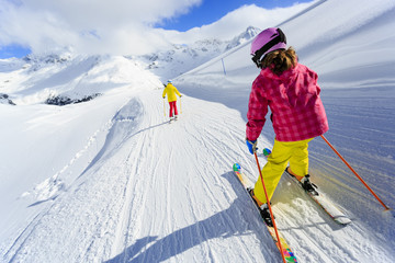 Skiing, skiers on ski run