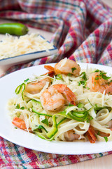 Tagliatelle pasta with fried shrimps and zucchini ribbons, tasty