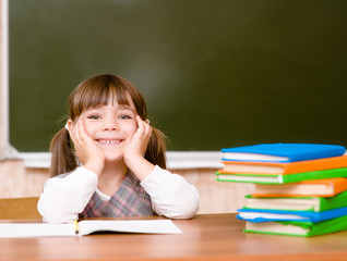 Portrait of lovely girl in classroom.