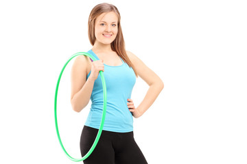 Young female athlete holding a hula-hoop