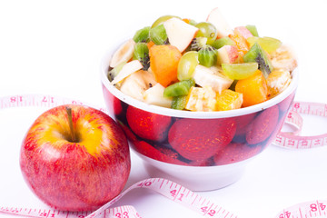 Plate of a tasty cuted fruits isolated on a white background wit