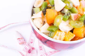 Plate of a tasty cuted fruits isolated on a white background wit