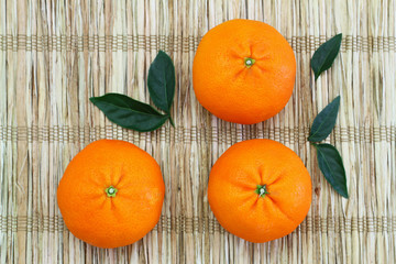 Mandarines on bamboo mat with copy space