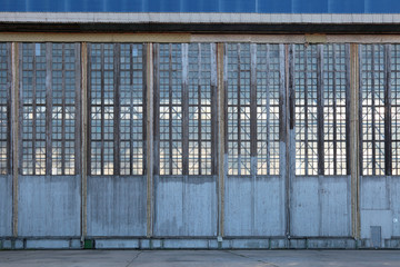 The huge gate of the assembly shop of the old aviation plant