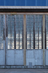 The huge gate of the assembly shop of the old aviation plant
