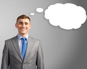 smiling business man thought cloud over his head