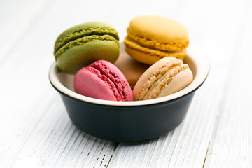 colorful macaroons in bowl