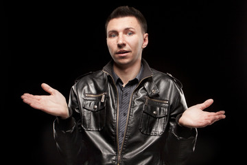 Bewildered man, isolated on black background