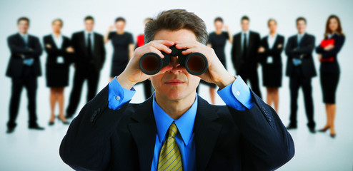 Businessman with binoculars.