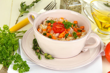 Delicious rice with vegetables and herbs in pot