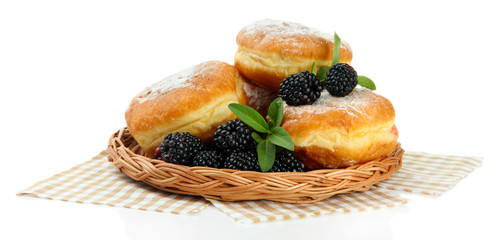 Tasty donuts with berries, isolated on white