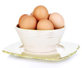 Eggs in bowl isolated on white