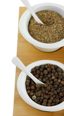 Assortment of spices in  white  bowls,