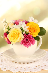 Obraz na płótnie Canvas Beautiful bouquet of bright flowers in color mug,
