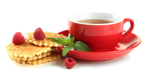 Obraz na płótnie Canvas Cup of tea with cookies and raspberries isolated on white
