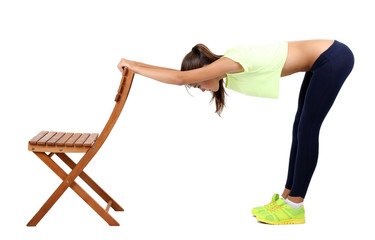 Beautiful young girl doing exercises isolated on white