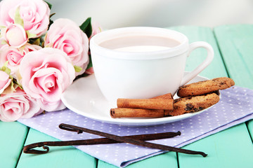 Cocoa drink  and cookies on wooden  table, on bright background