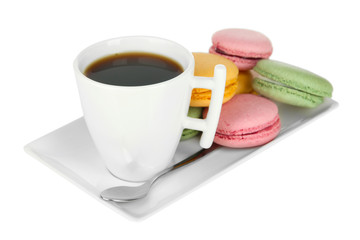 Coffee and macaroons isolated on white