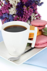 Coffee and macaroons close-up