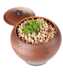 Buckwheat with verdure in pot isolated on white