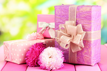 Gifts and flowers, on nature background