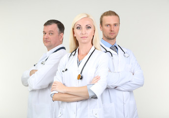 Fototapeta premium Medical workers on grey background