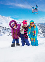 Three kids together in ski resort